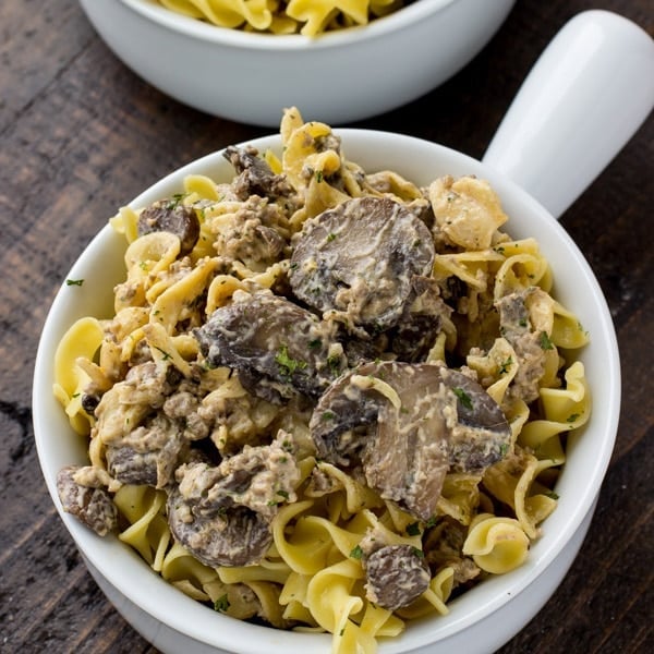 This Instant Pot Hamburger Stroganoff is quick, easy, and so delicious! Full of egg noodles, ground hamburger, mushrooms, and spices! Ready in 30 mins! deliciouslysprinkled.com #instantpot #dinner