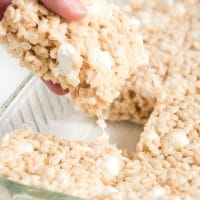 rice krispie treats being pulled from pan