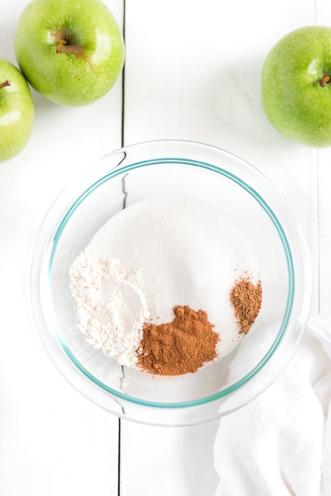 mixing apple topping in bowl