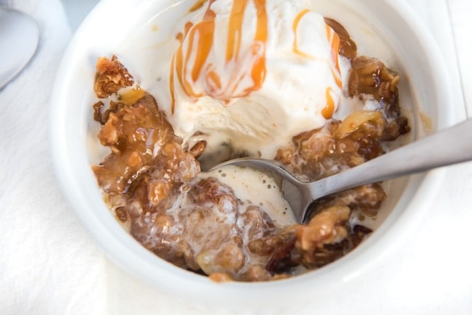 apple crisp topped with melting ice cream