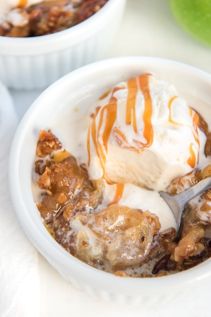 apple crisp topped with melting ice cream