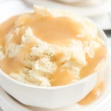 bowl of mashed potatoes with turkey gravy