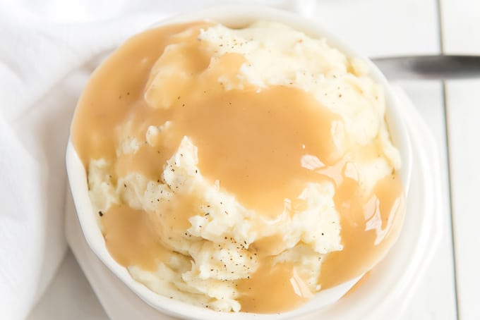 bowl of mashed potatoes with turkey gravy