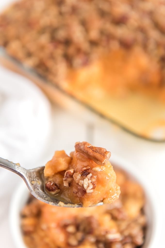 bite of sweet potato casserole on spoon