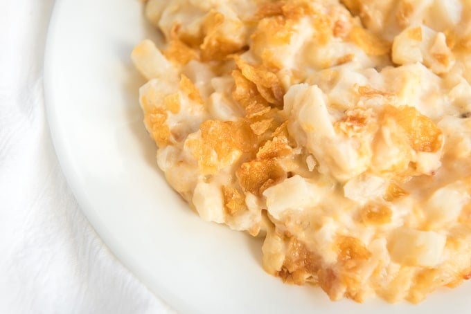up close shot of cheesy hash brown casserole plated