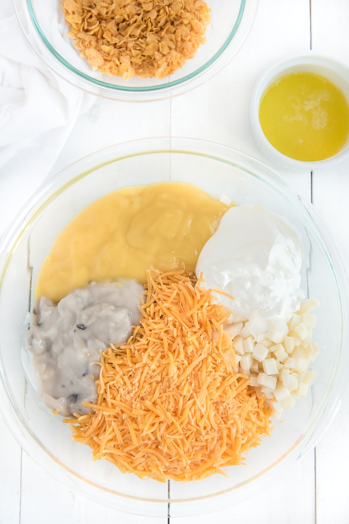 cheesy hashbrown casserole ingredients in bowl