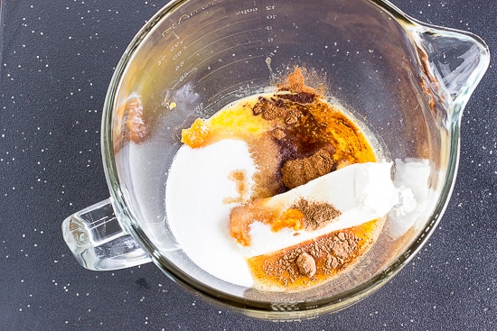 mixing the ingredients for pumpkin cheesecake bars filling