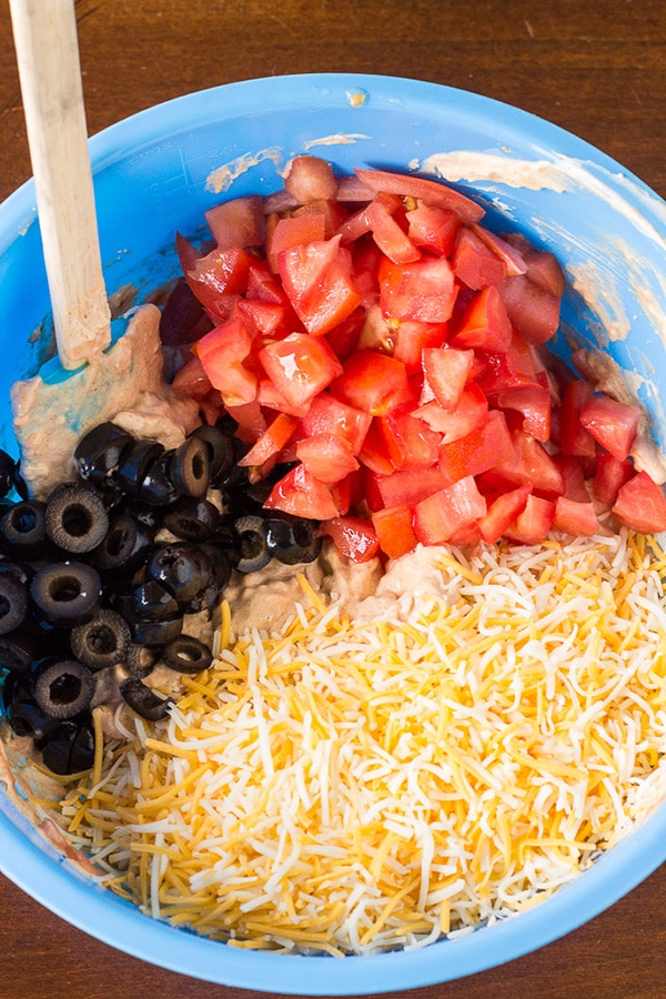 taco dip ingredients in a mixing bowl
