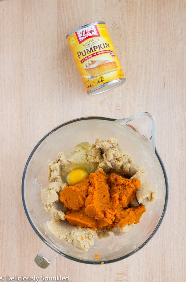 All of the ingredients for the cookies are placed in a large glass bowl.