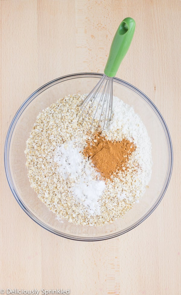 Dry ingredients are being mixed together with a whisk. 