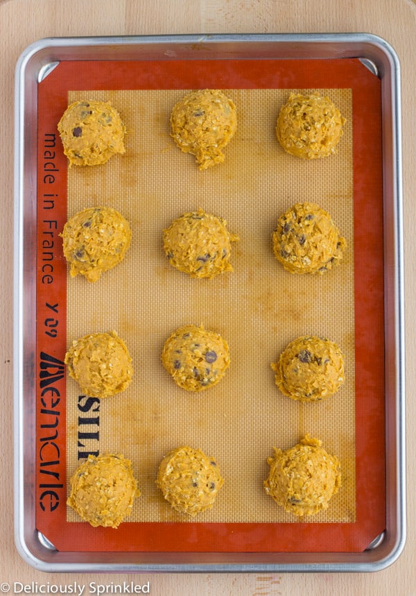 Dough balls are placed on a prepared baking sheet.
