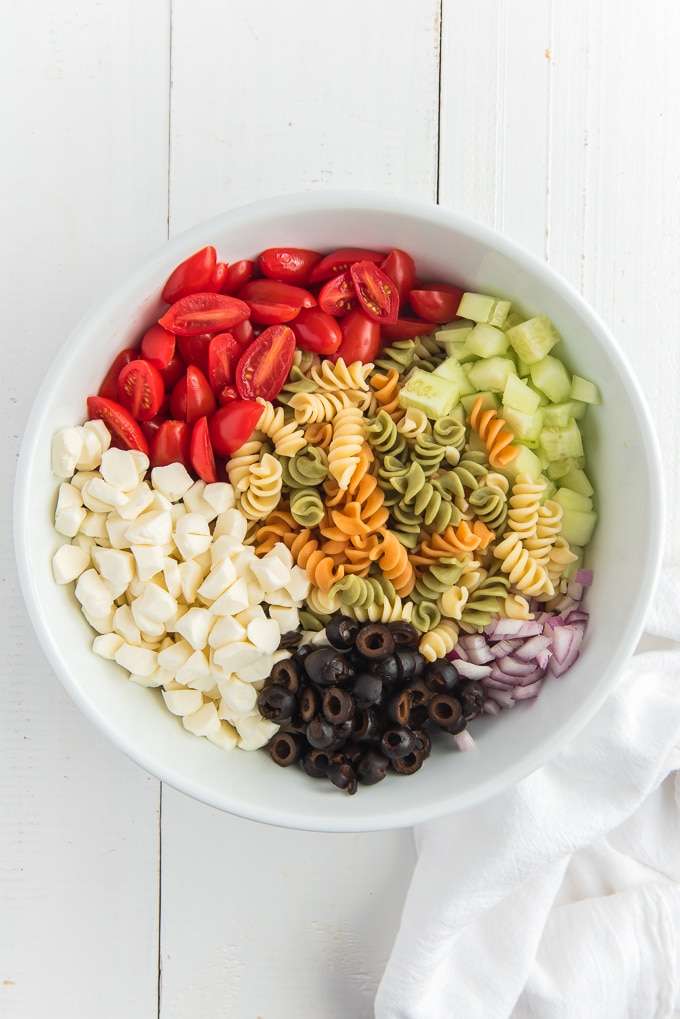 pasta salad with tomatoes cucumbers olives and cheese