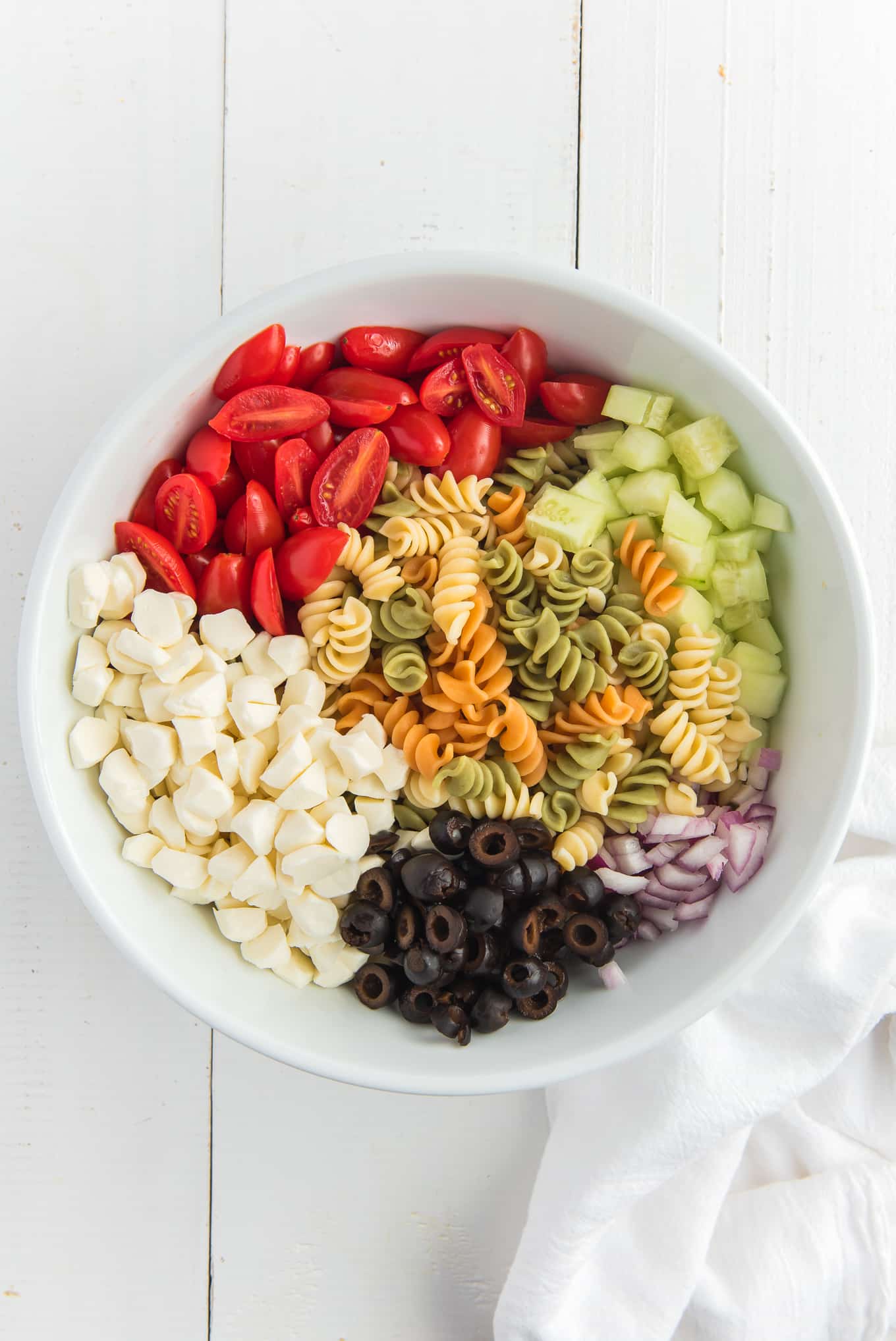 Pasta Salad without dressing/ Easy Pasta Salad is the best cold pasta salad with tri color pasta, tomatoes, cucumbers, onions, and mozzarella cheese tossed in olive garden Italian dressing. 