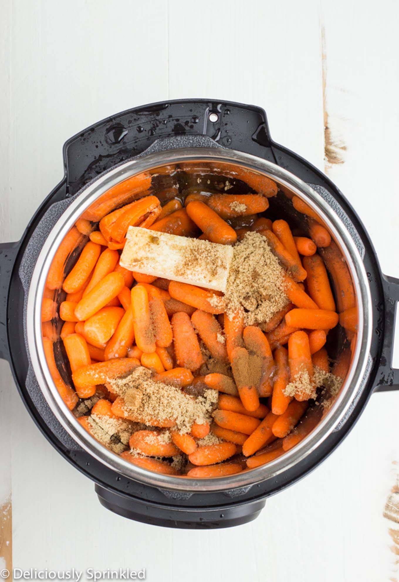 Instant Pot Glazed Carrots in the instant potl/ Brown sugar carrots only use simple ingredients and only takes less than 10 minutes to make. Perfect holiday side dish that everyone will love. 
