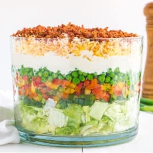 Classic 7 layer salad in a large bowl.