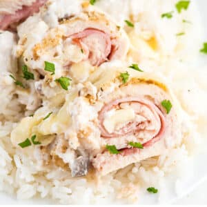 Baked chicken cordon bleu recipe served up on a plate over rice.