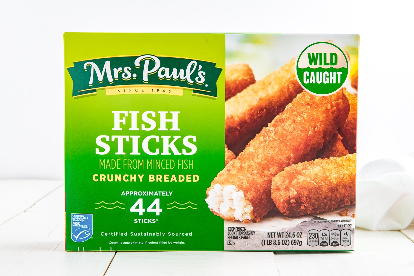 A box of Mrs. Paul's frozen fish sticks on a table.
