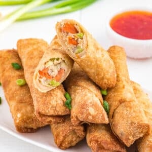 frozen egg rolls made in the air fryer on a plate.
