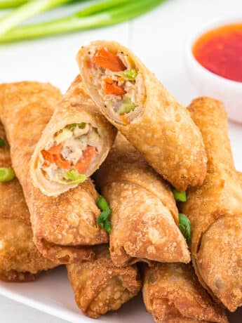 frozen egg rolls made in the air fryer on a plate.