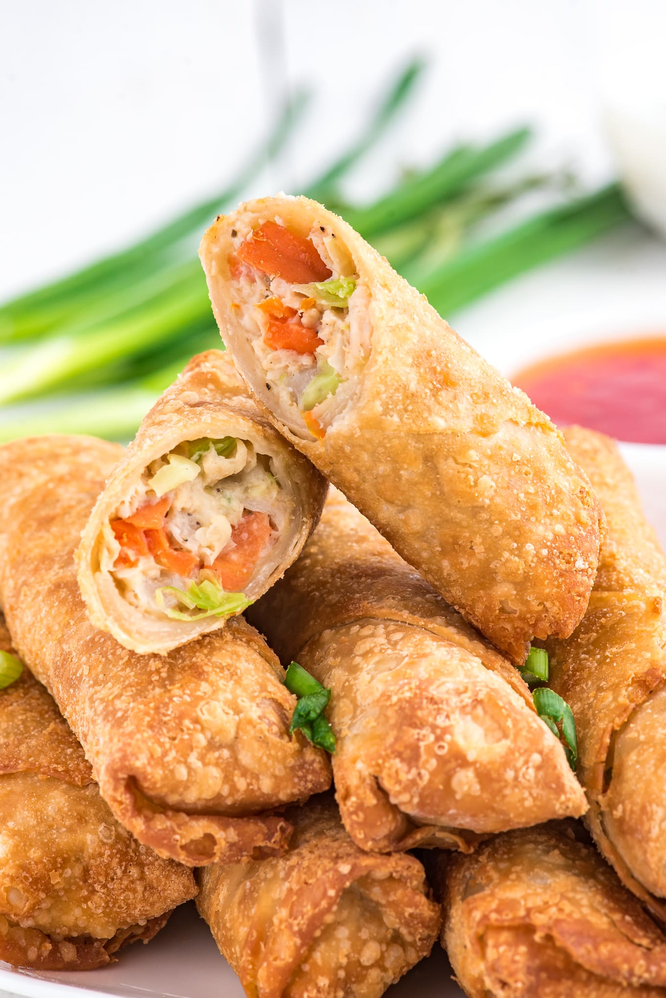 Air fryer egg rolls cut in half to show texture and crispness. 