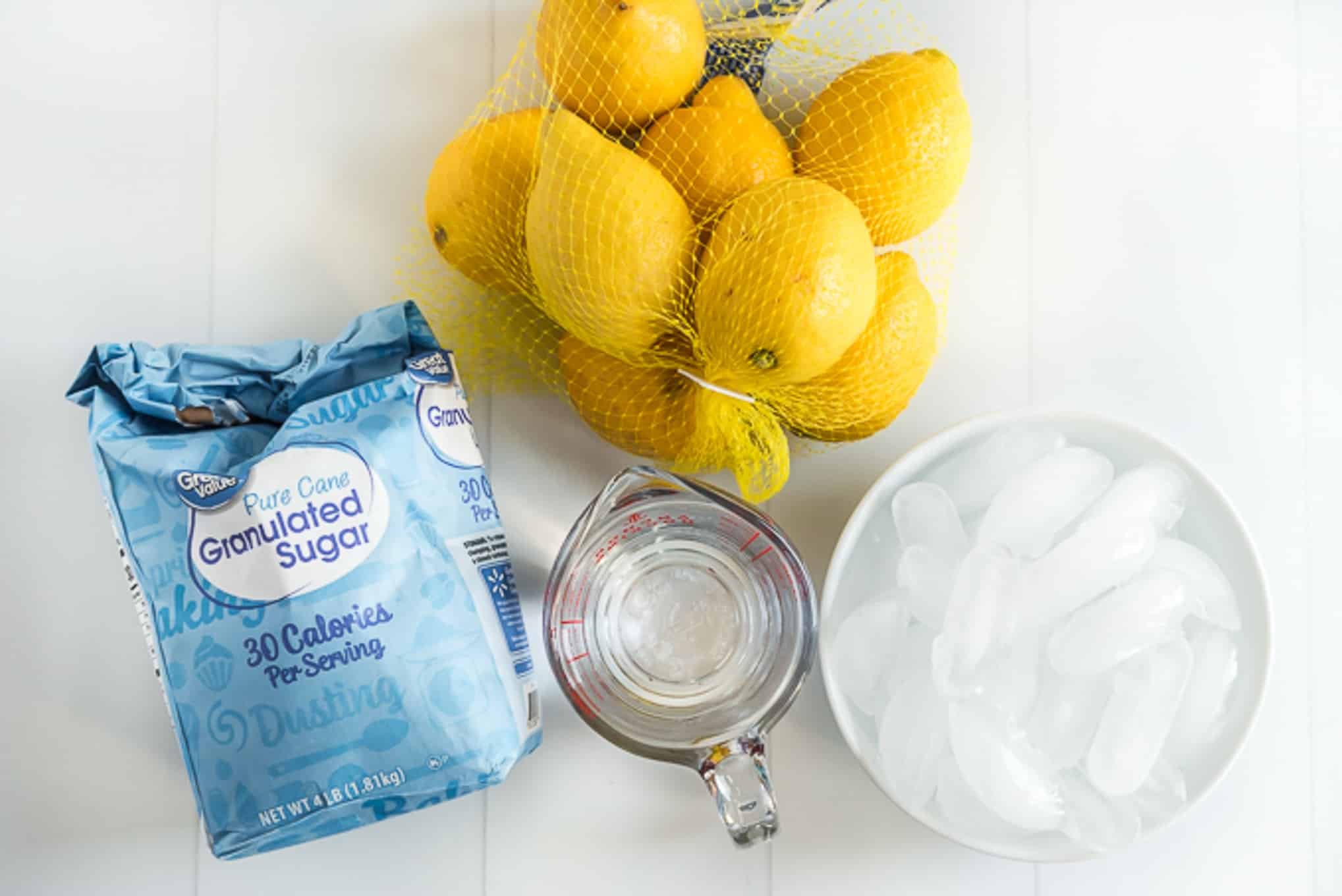 Ingredients laid out for homemade lemonade recipe. 
