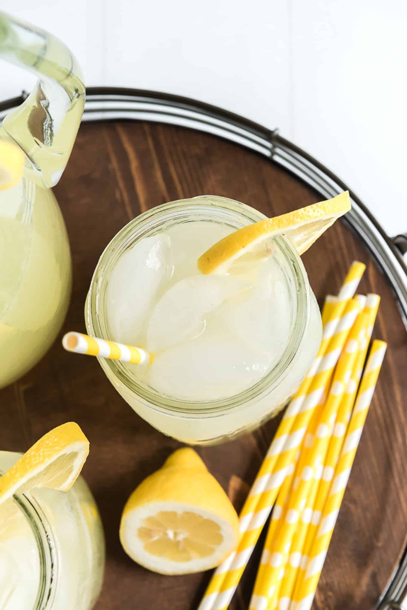 Above shot of lemonade with straw and lemon slice. 