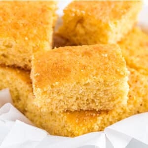 Jiffy cornbread cut into squares in a serving basket.