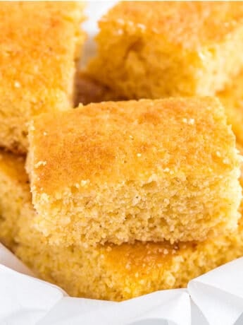 Jiffy cornbread cut into squares in a serving basket.