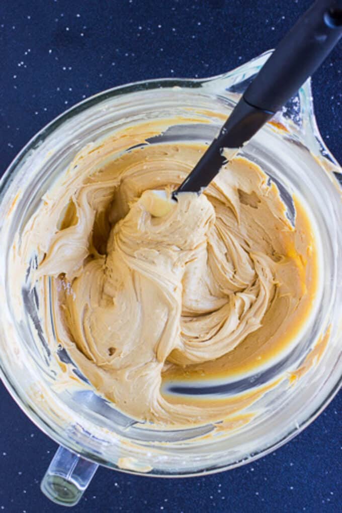 A glass mixing bowl of the peanut butter whoopie pie filling.