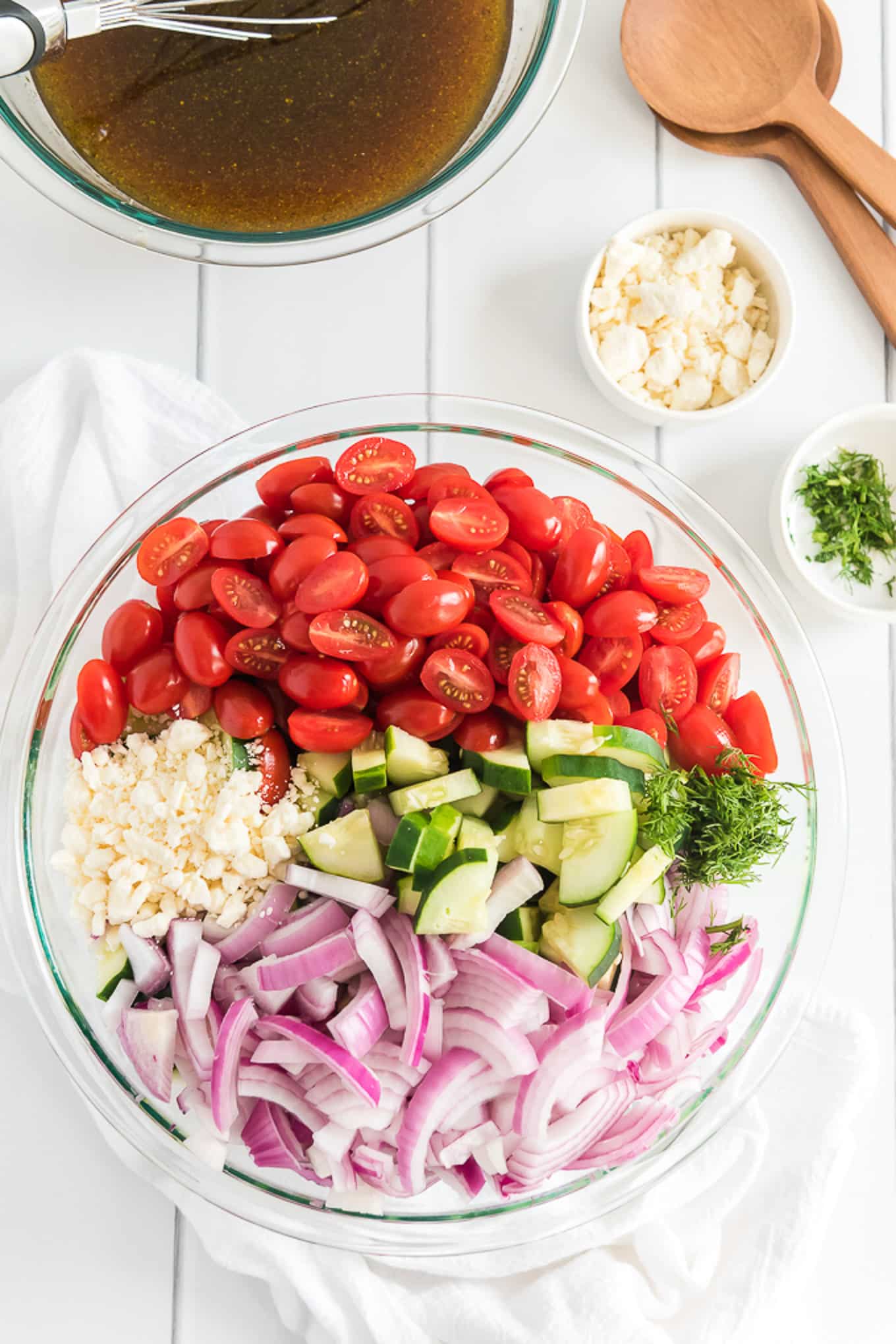 Fresh cut veggies in a bowl to make tomato cucumber salad.