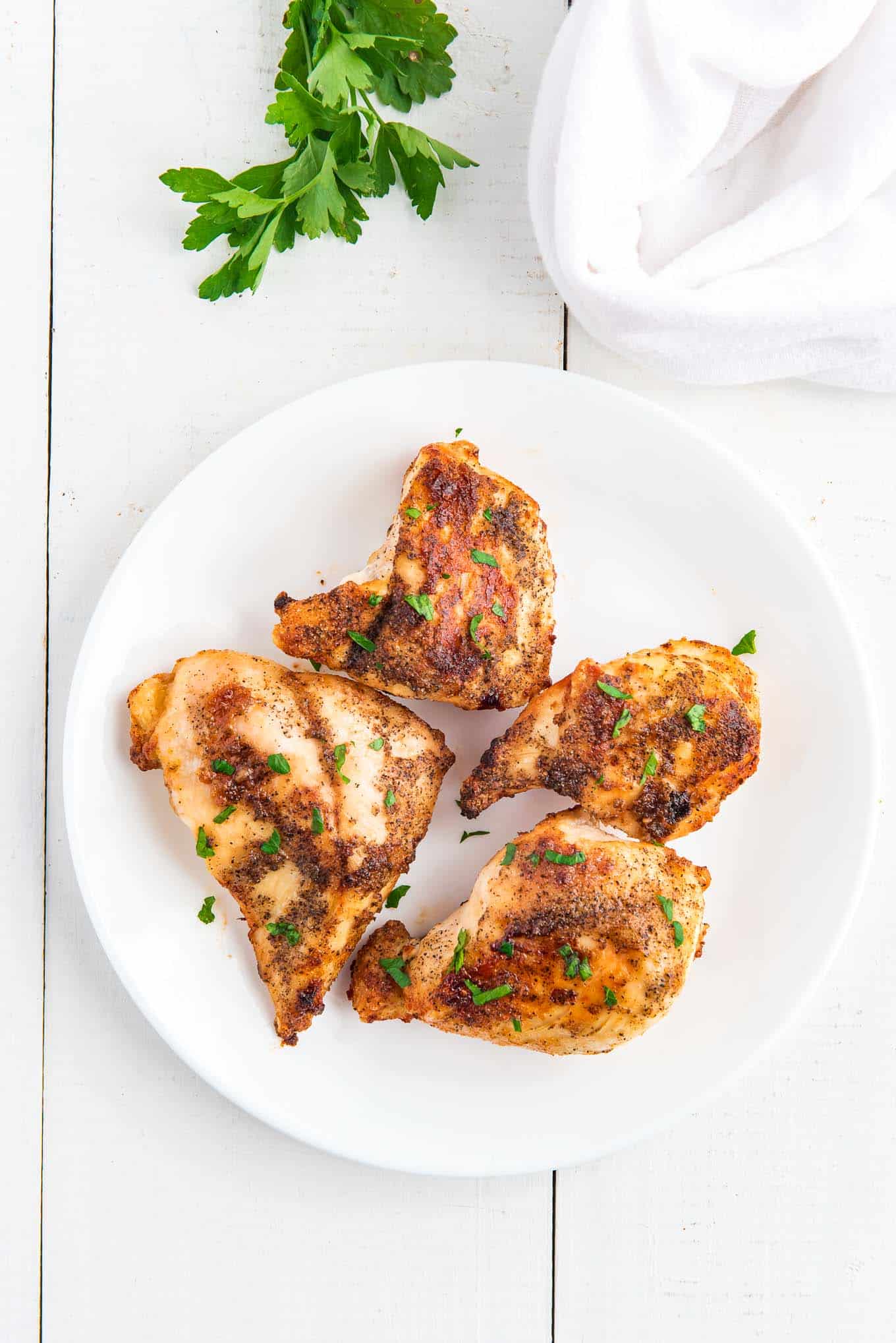 Air Fryer Chicken breasts on a plate ready to eat. 