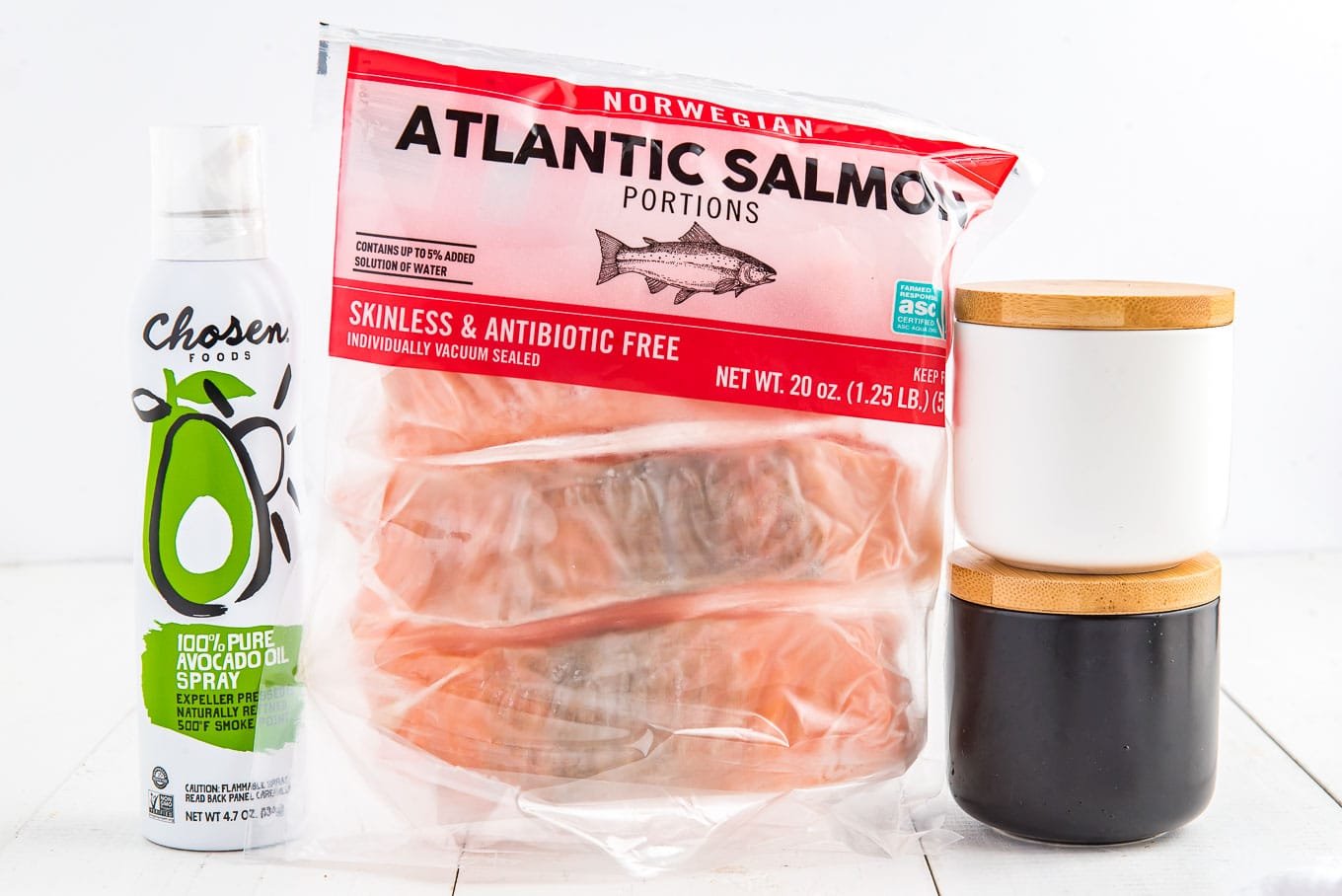 Ingredients to make air fried frozen salmon on the counter.