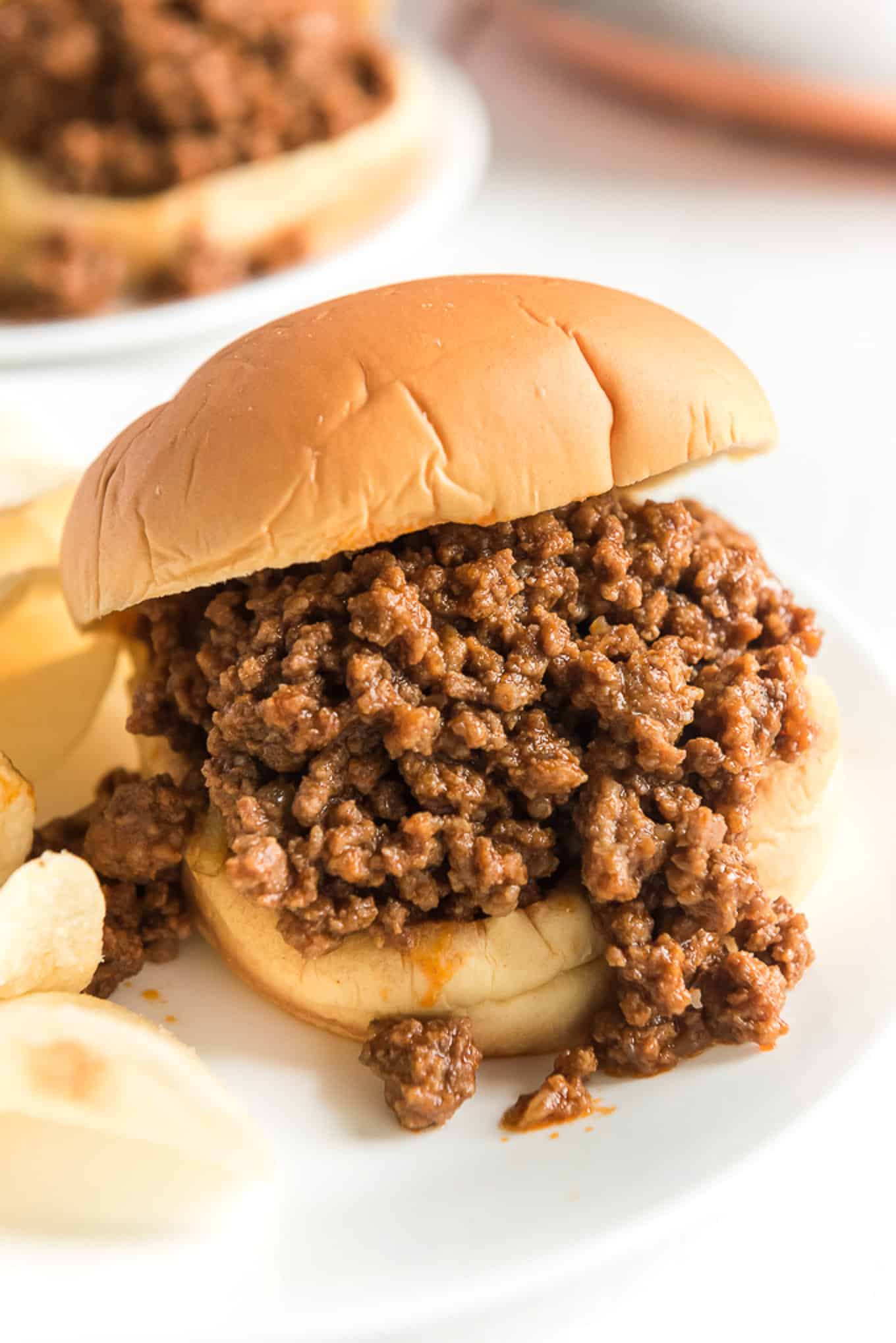 Easy sloppy joe on a plate with potato chips.