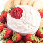 Cool whip dip with strawberries.