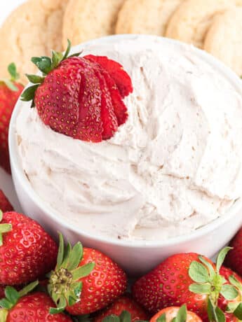Cool whip dip with strawberries.