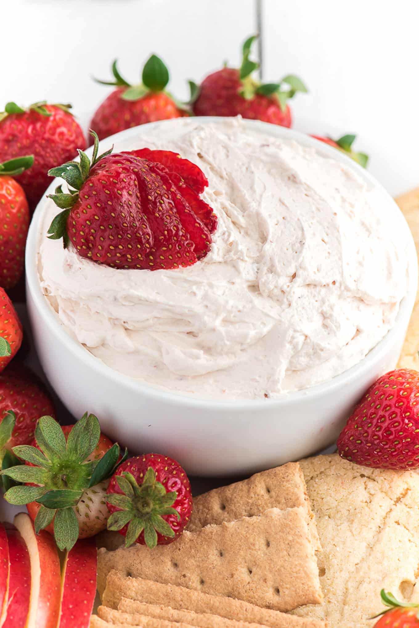 Delicious prepared fruit dip garnished with a strawberry.