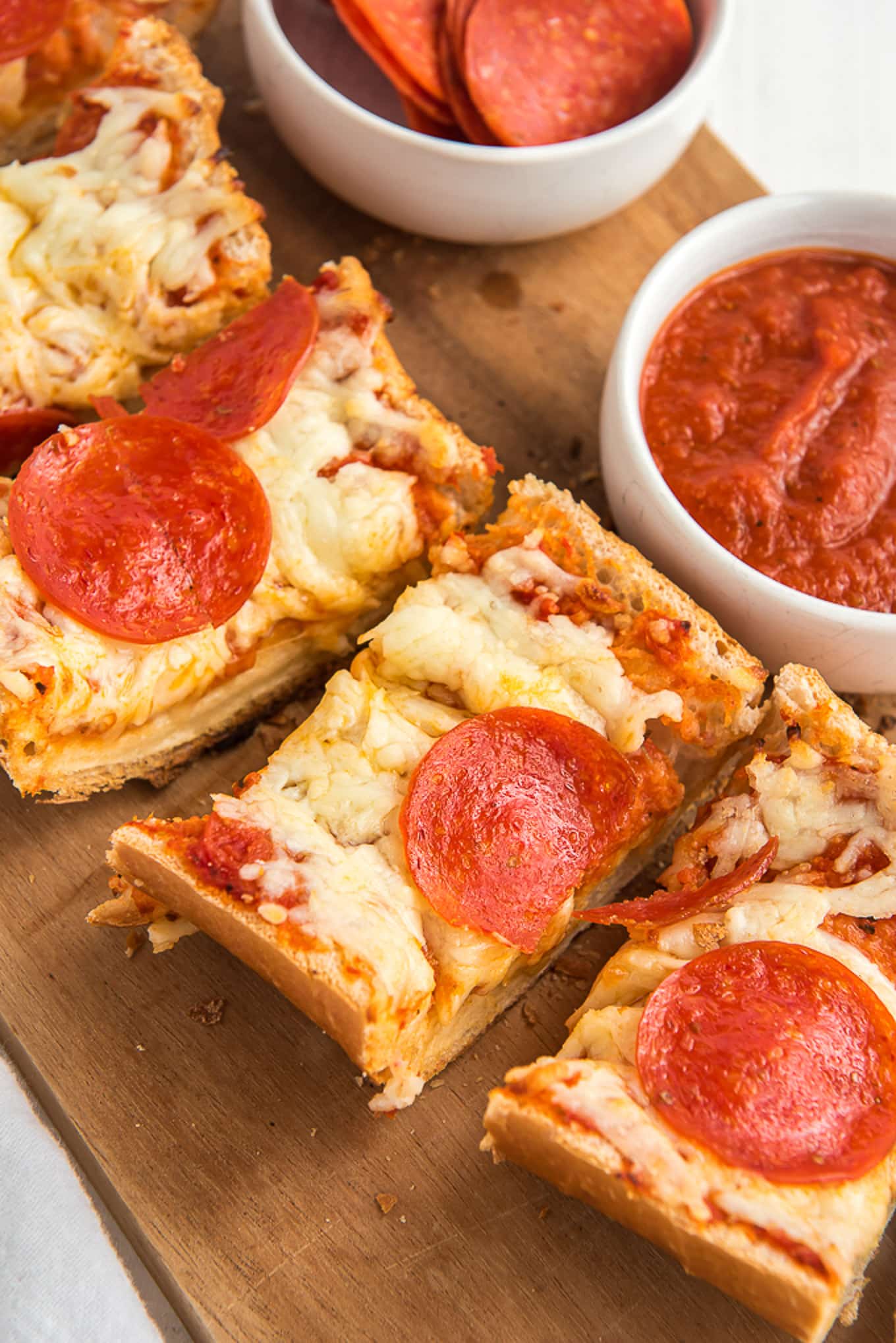 Tasty french bread pizza cut into slices.