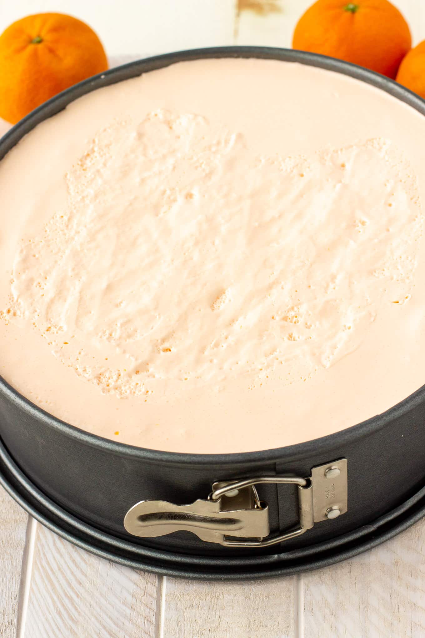 Creamy orange pie in a cheesecake pan.