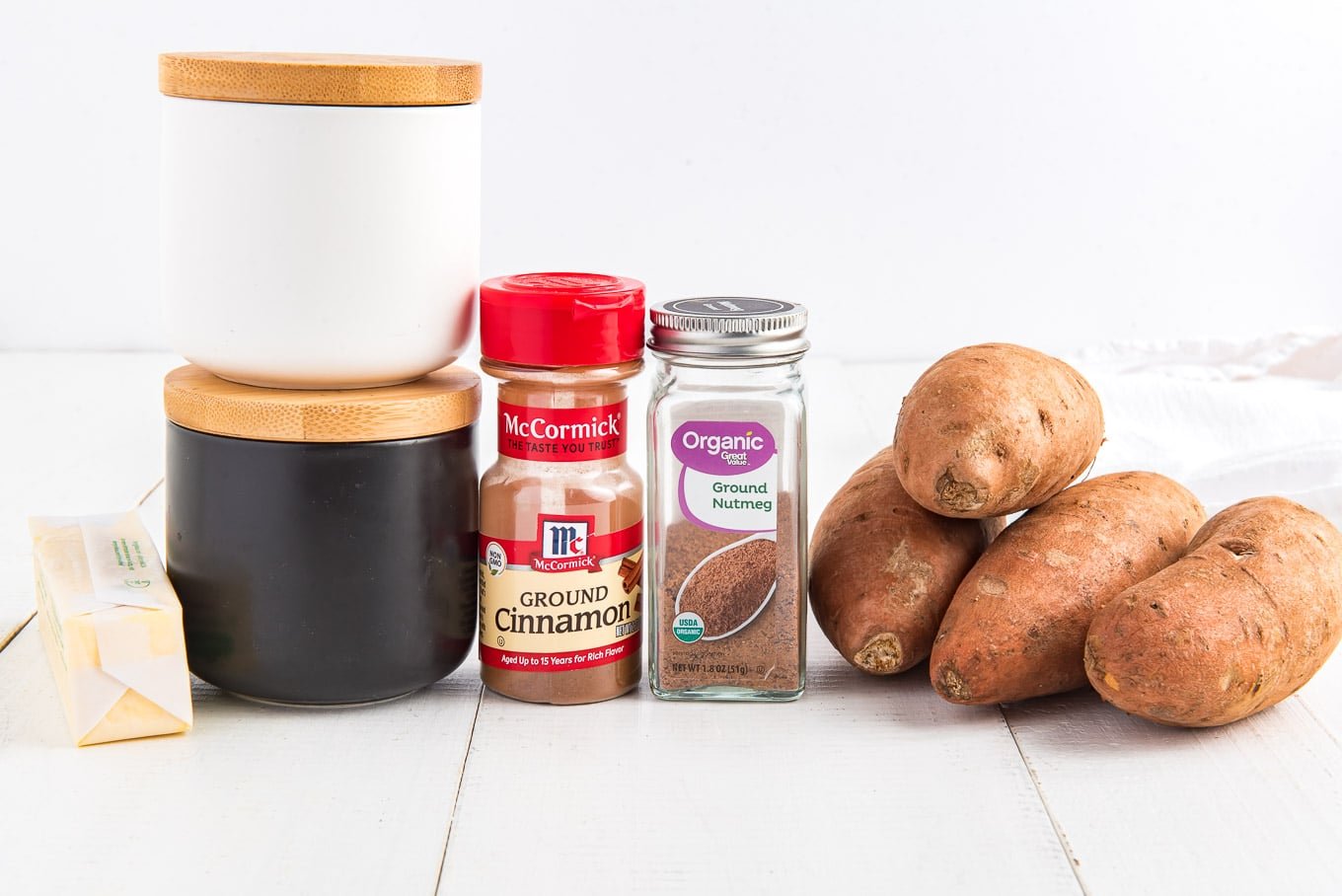 Ingredients to make sweet potatoes in the microwave on the table.
