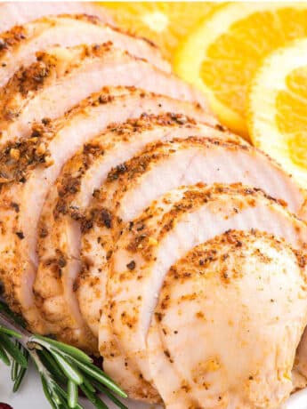 Boneless turkey breast roasted in the oven and served up sliced on a platter.