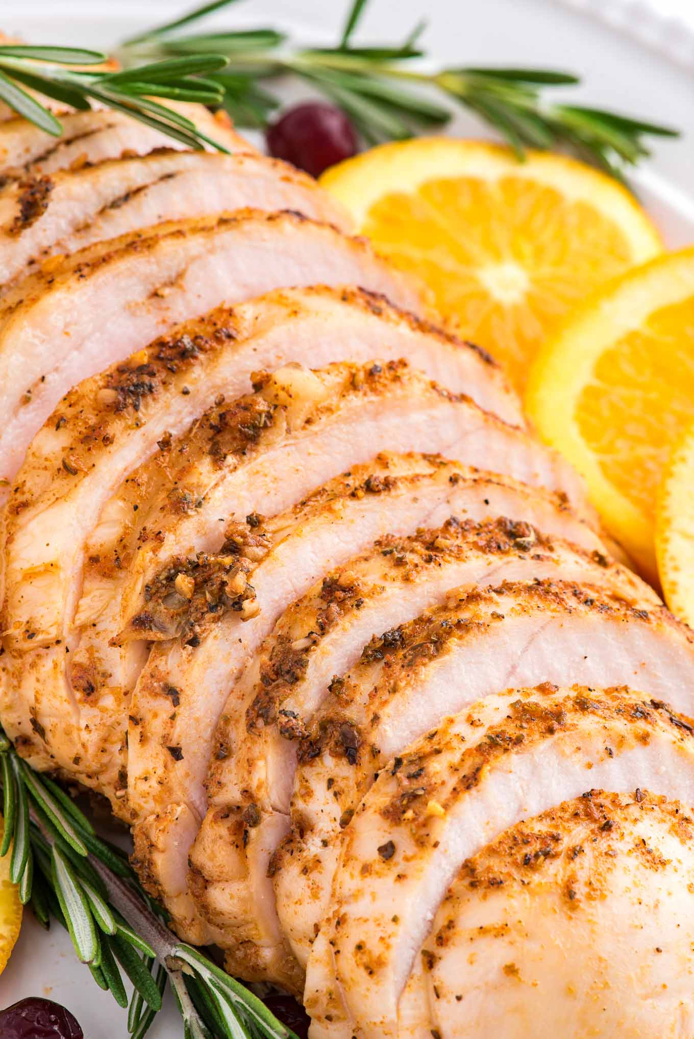 Sliced boneless turkey breast roasted and sliced on a platter.