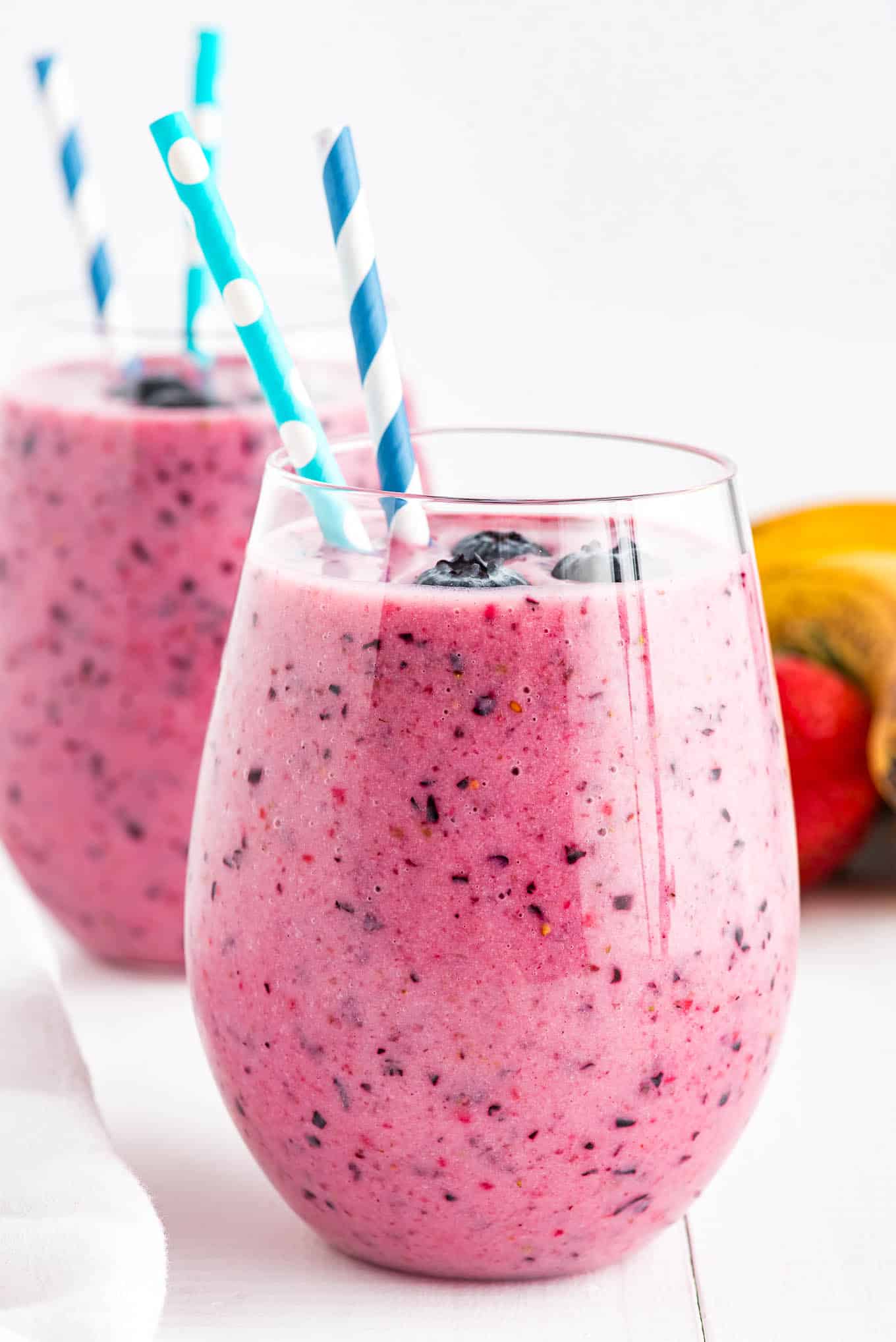 Glass of blueberry smoothie.