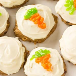 Plate of carrot cake cookies with cream cheese frosting.