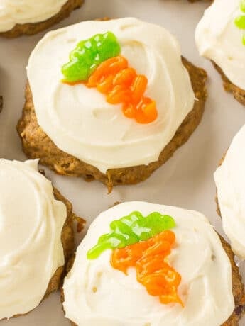 Plate of carrot cake cookies with cream cheese frosting.