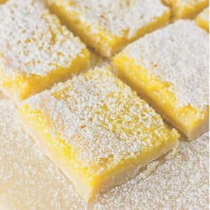 Cut lemon bars sprinkled with powdered sugar and cut into squares.